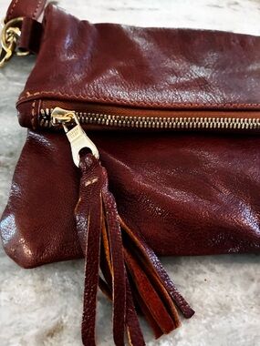 $198 Cognac Leather Parker clay Fold-Over Crossbody Bag, goat leather.